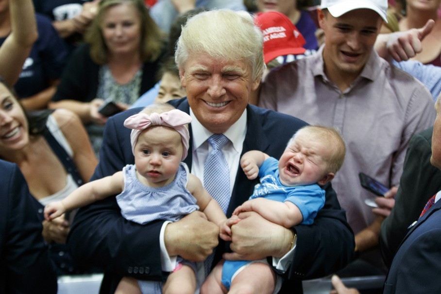 trump holding babies