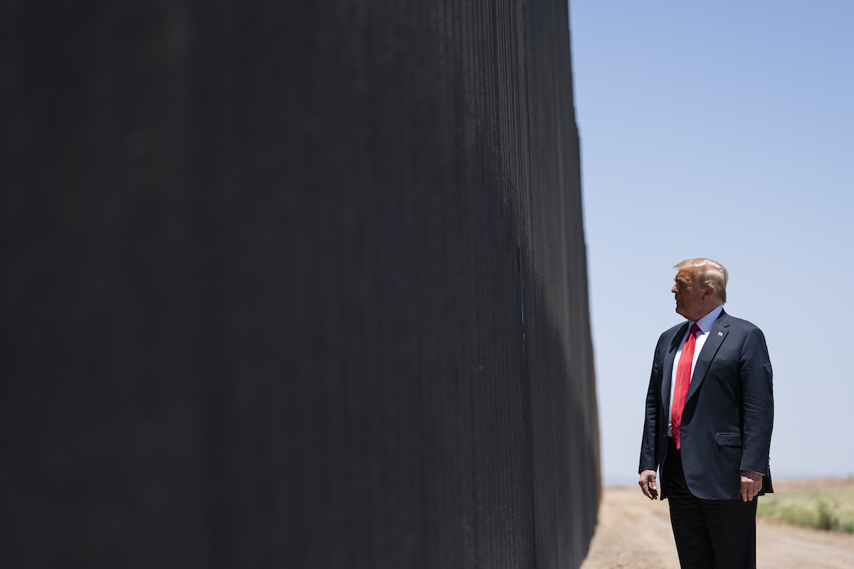 Trump stands next to border wall 2020