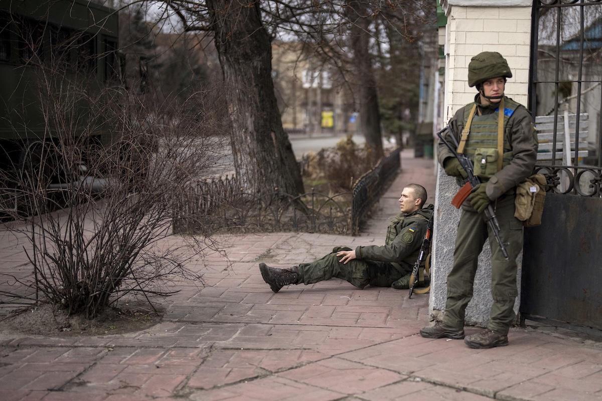 Soldier in crossfire in Kyiv in Feb 2022
