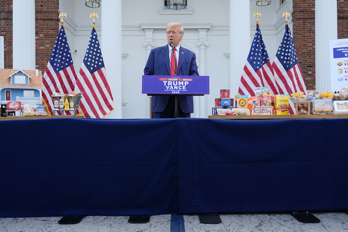 Trump at Bedminster with groceries behind him