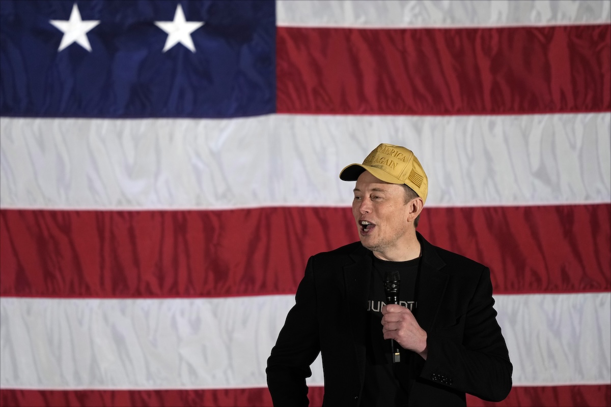 Elon Musk in front of big U.S. flag in Folsom, Pa, 10-17-2024