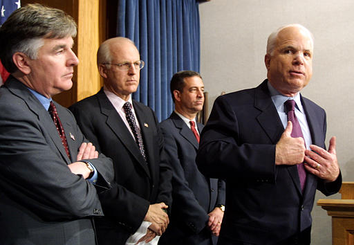 mccain talking at podium with lawmakers campaign finance
