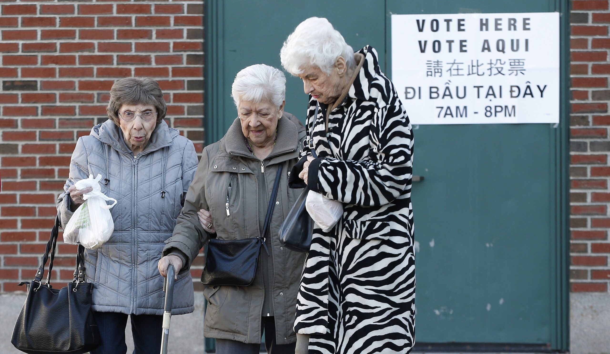 Three women leave voting polling station in Mass 3-1-16
