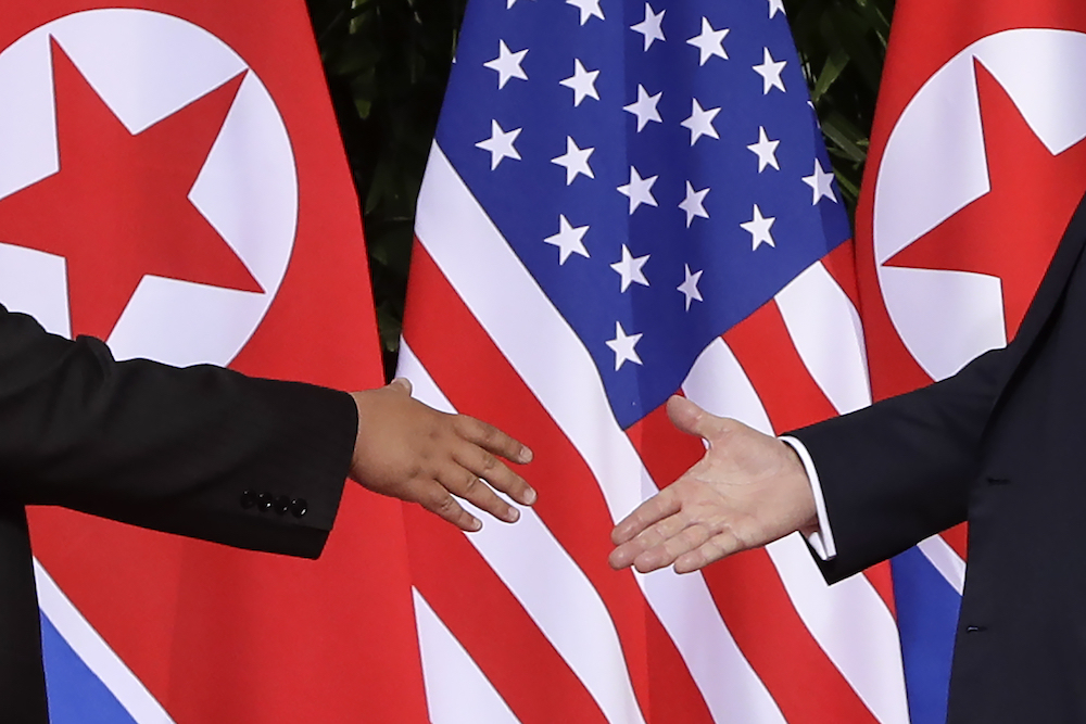 Trump, Kim shaking hands CLOSE
