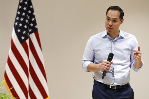julian castro next to american flag iowa townhall feb 2019