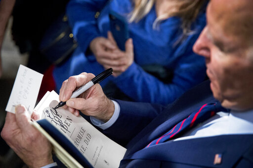 Biden signing book Iowa (file) 10 22 20