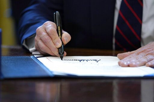 trump signing stimulus relief package march 27 2020