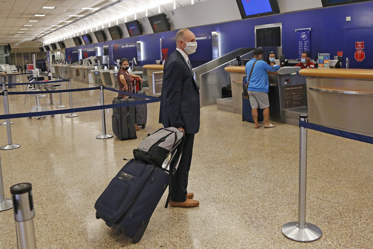 Airport traveler with mask