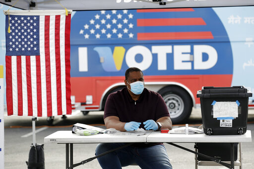 Masked poll worker