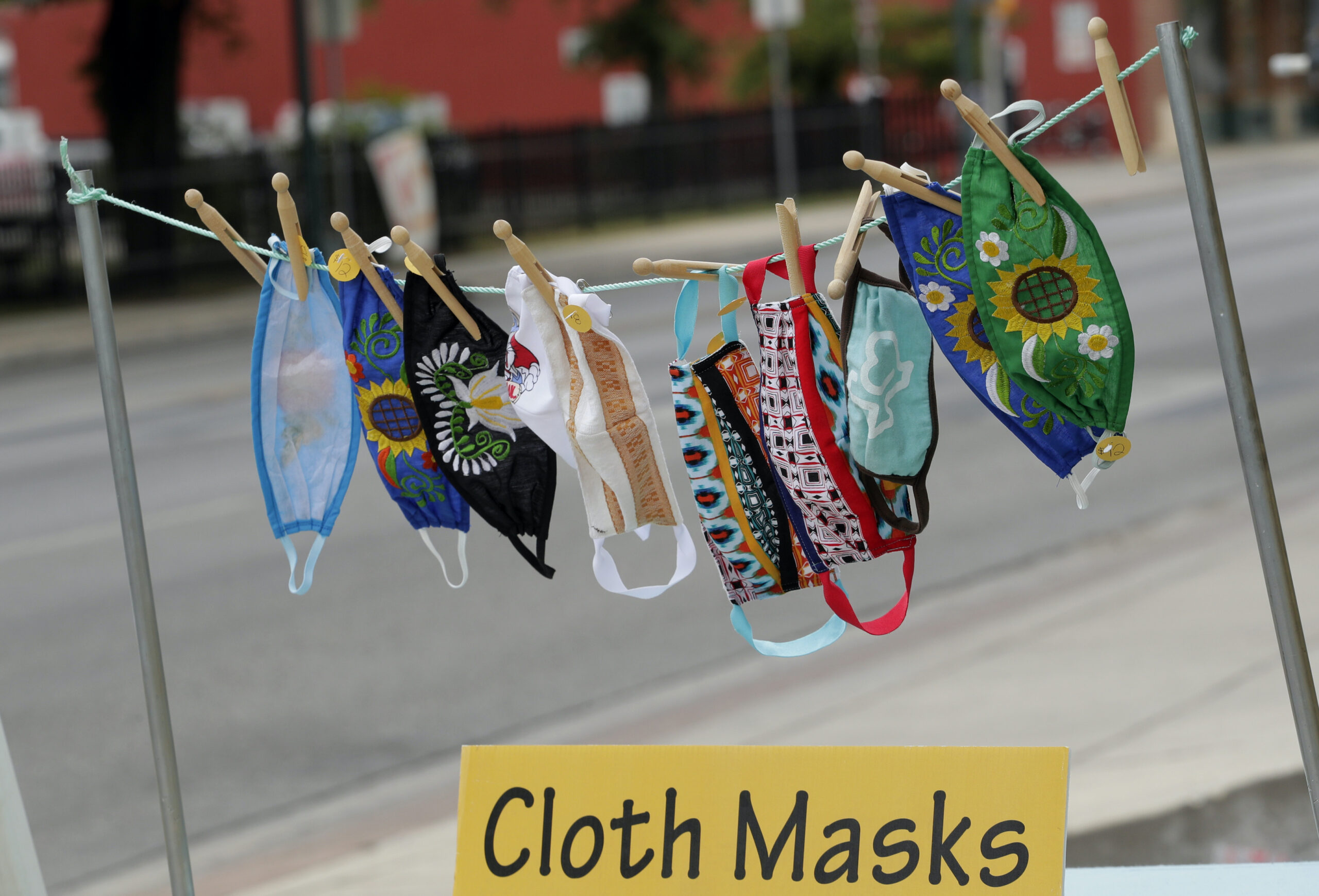 Homemade masks hanging for sale