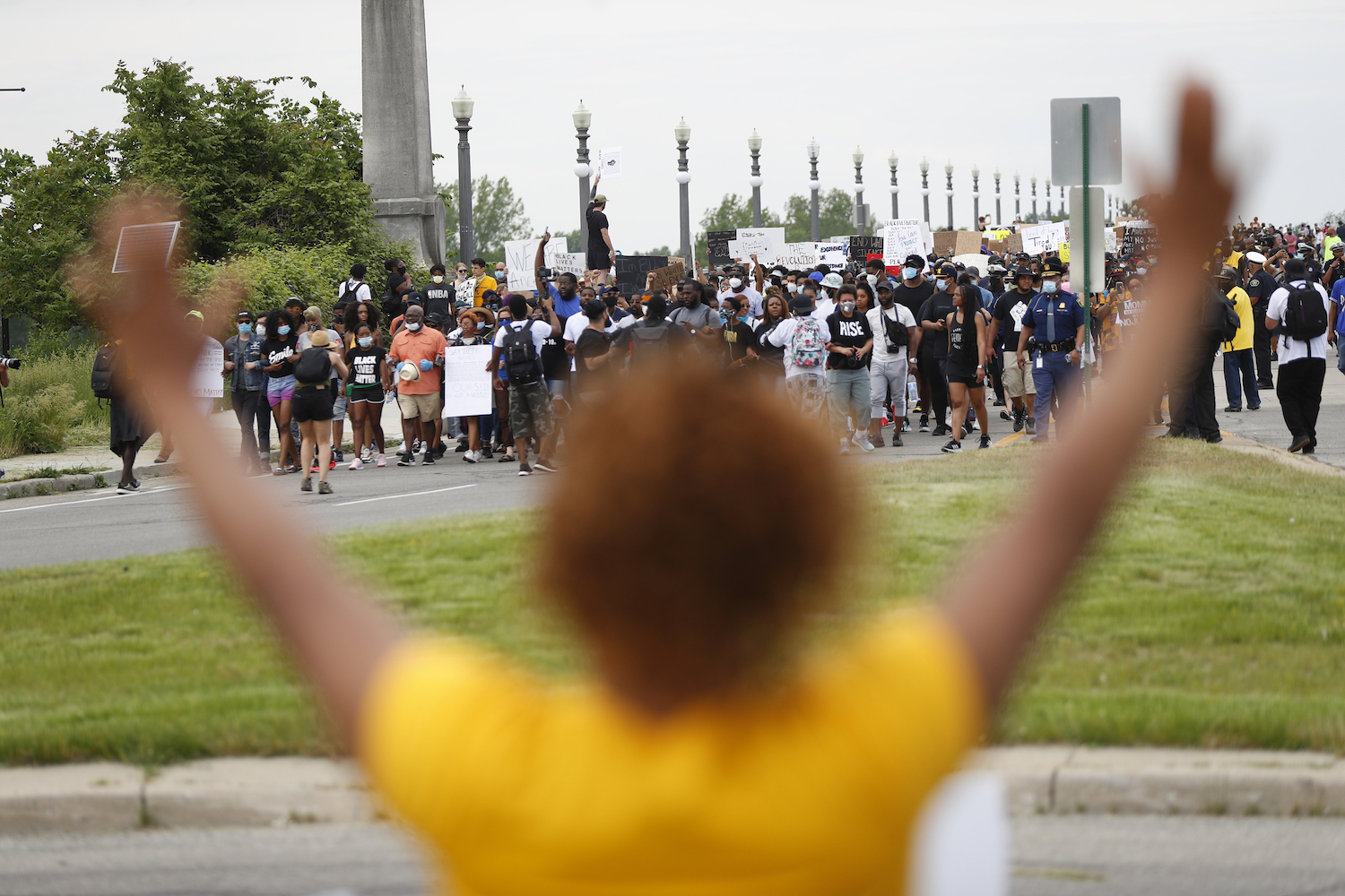 Detroit protest woman yellow