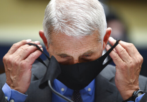 Fauci doffing mask file photo 10 21 20