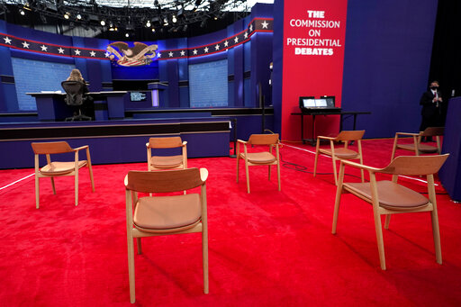 Socially distanced chairs at debate