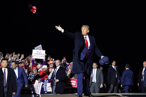 trump throwing maga hat at Sept 30 2020 rally in Minnesota