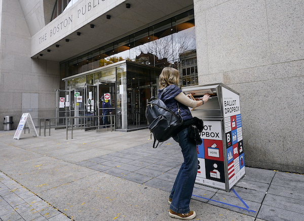 voter uses mail drop box