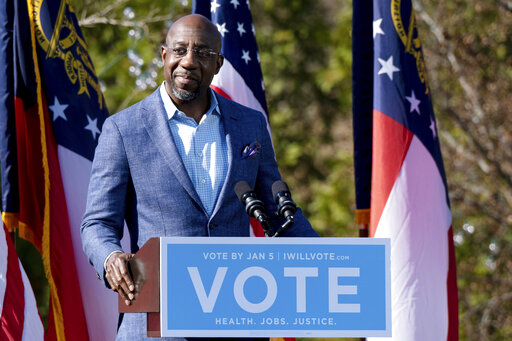 warnock at podium dec 2020