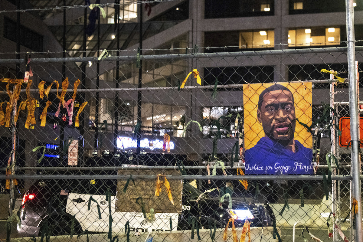George Floyd photo outside courthouse fence Chauvin trial