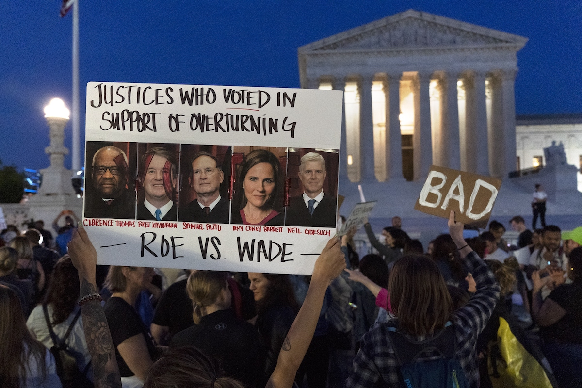 Protest sign outside SCOTUS after Roe leak