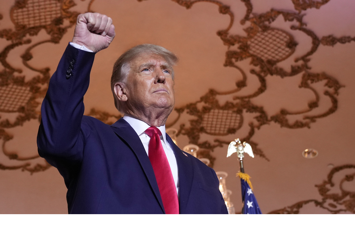 Trump at 2024 run announcement with fist in air Nov. 15, 2022