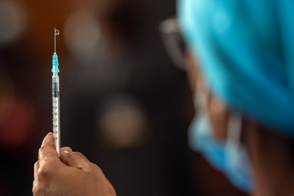 Healthcare worker in South Africa prepares Pfizer vaccine