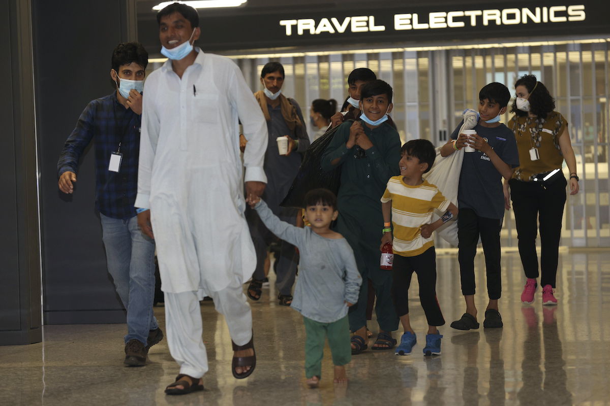 Afghan refugees arrive at Dulles International Airport
