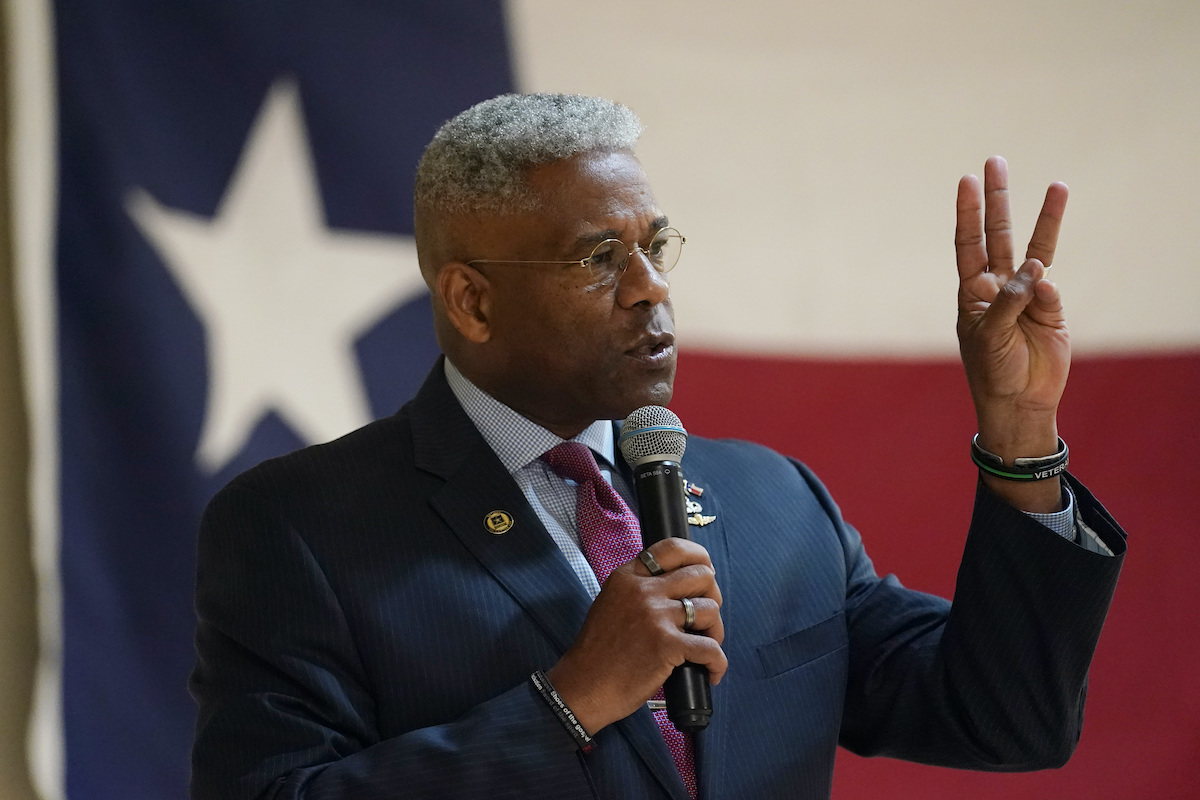Allen West in front of a flag in Texas 9-22-21