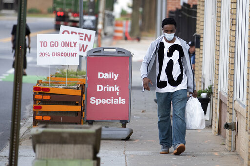 man with takeout from restaurant in Atlanta March 2020