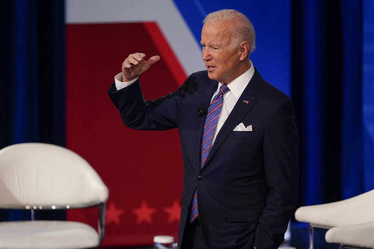 Biden at CNN town hall with hand up on stage alone 10-21-21
