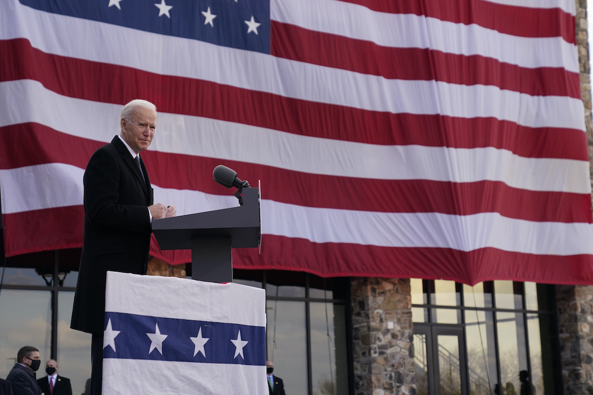Biden by flag in New Castle, Delaware 1-19-21