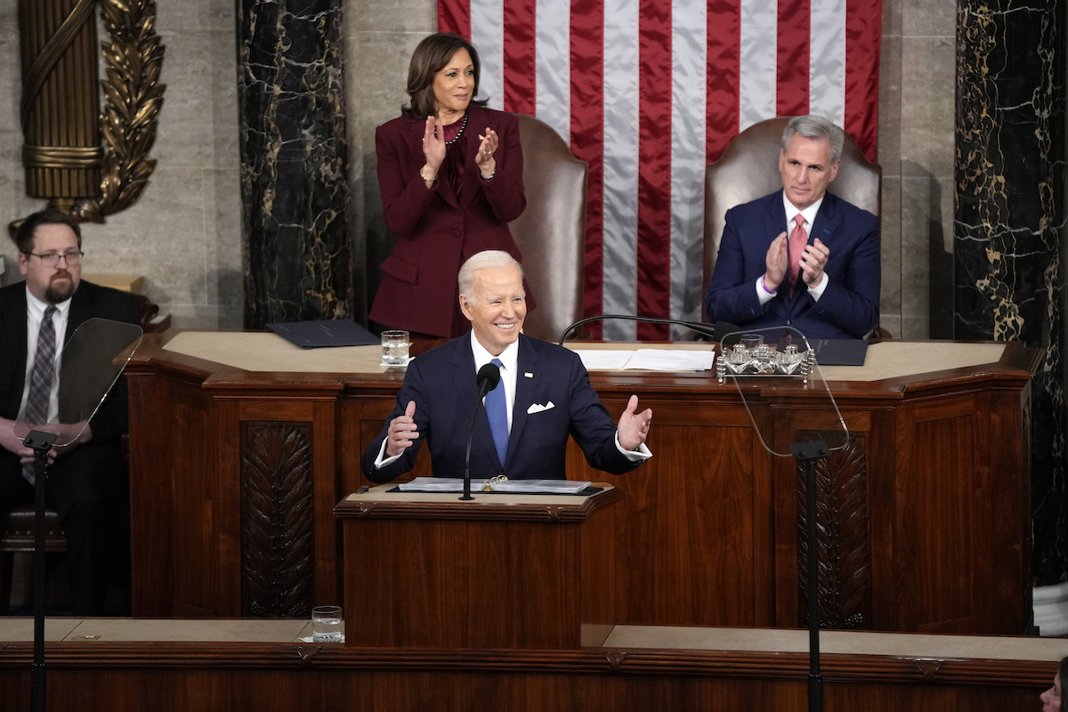 Biden smiling at podium at SOTU 2023