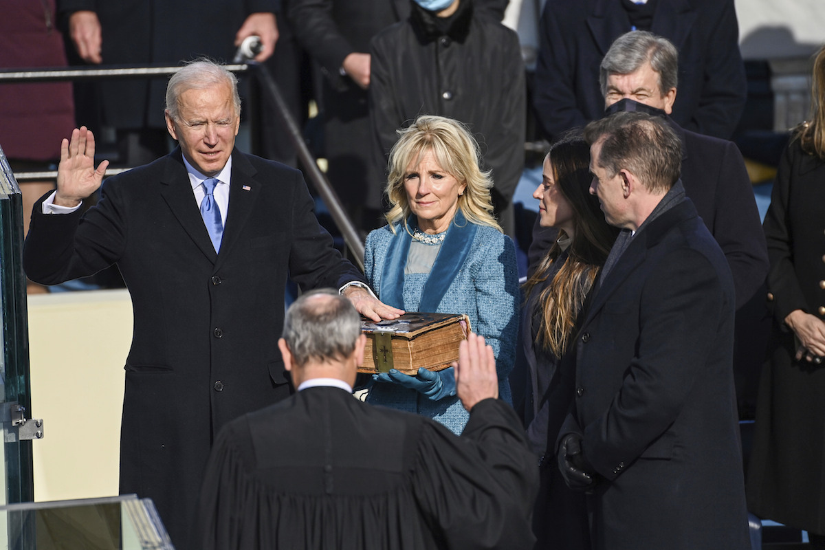 Joe Biden takes the oath, family in background