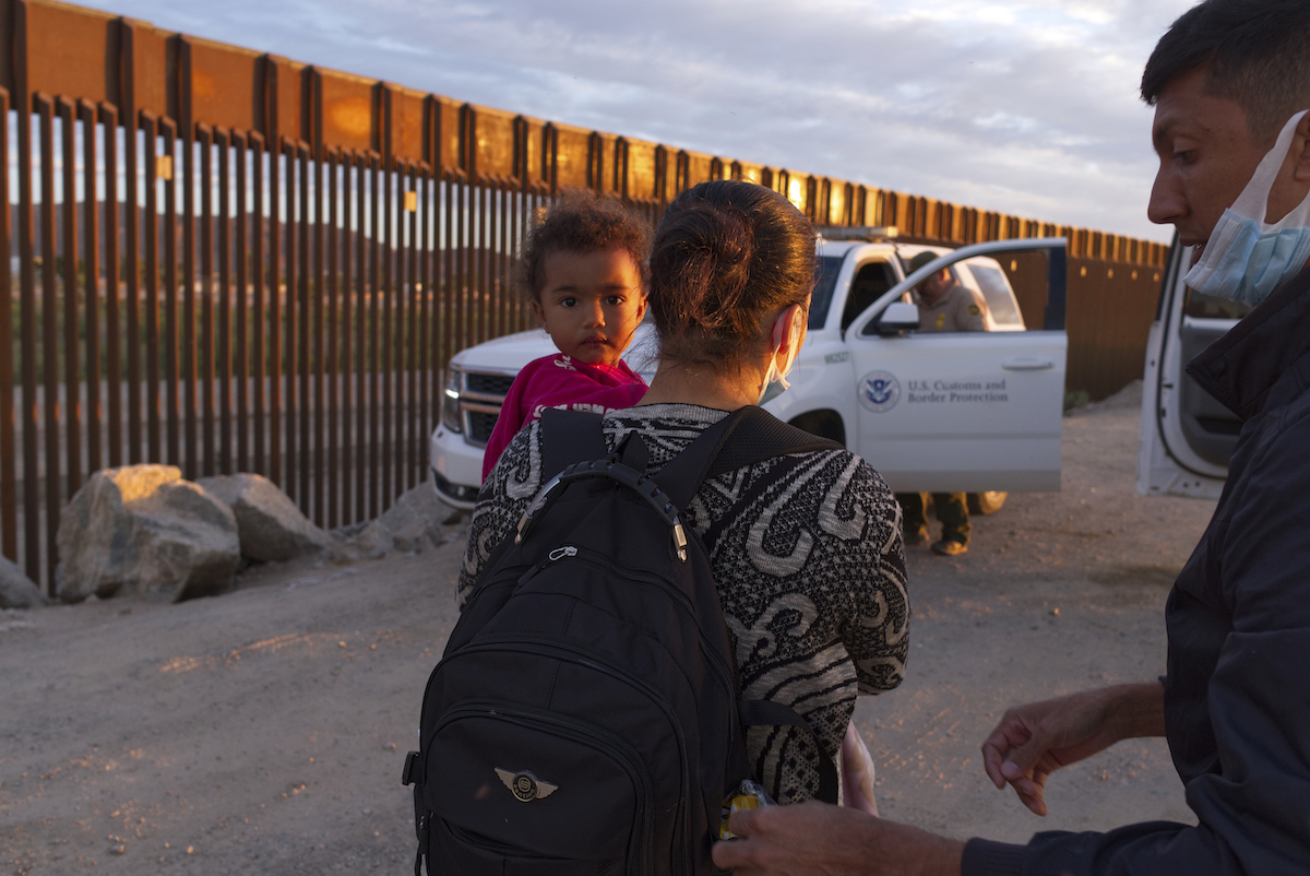 Migrants wait for processing in Yuma, Ariz., 6-10-2021