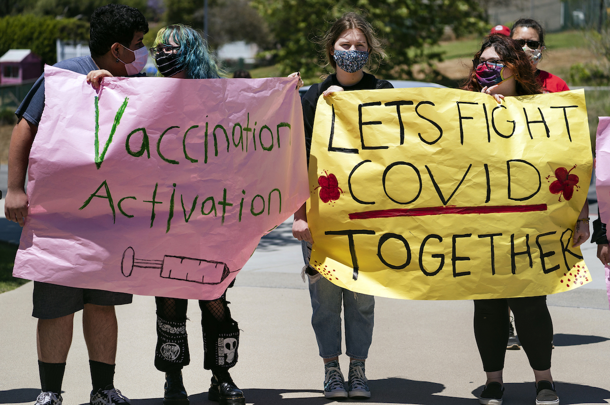 California high school students holding covid vaccination signs 5-24-21