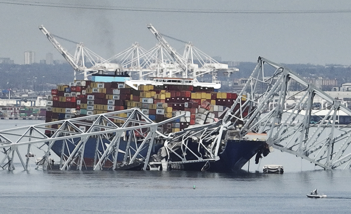 Cargo ship stuck under bridge zoomed in shot 3-26-2024
