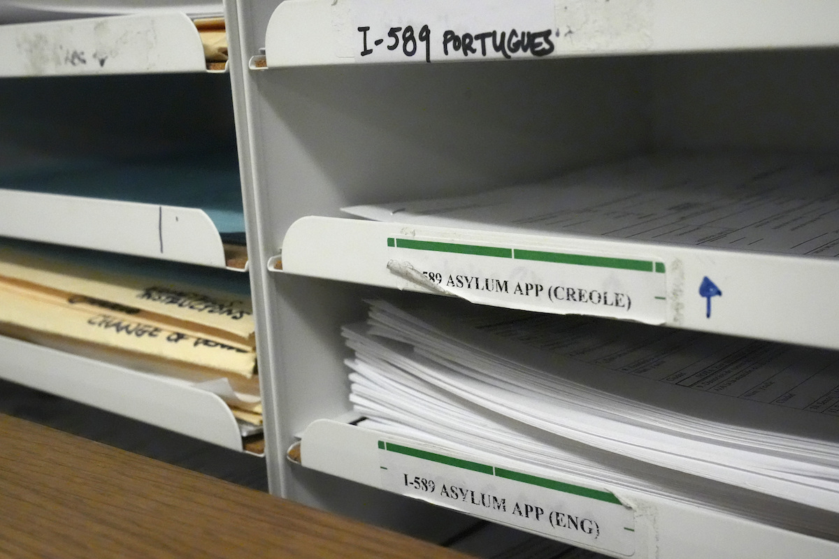 Stack of asylum application papers in Miami, 1-10-2024