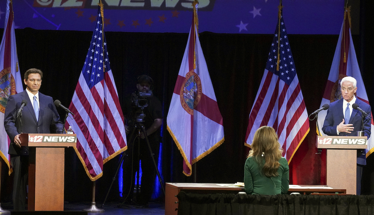DeSantis and Crist stand side-by-side at Debate 10-24-22