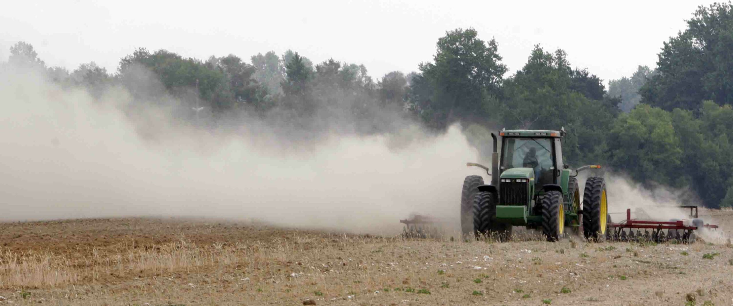 Farm dust and tractor