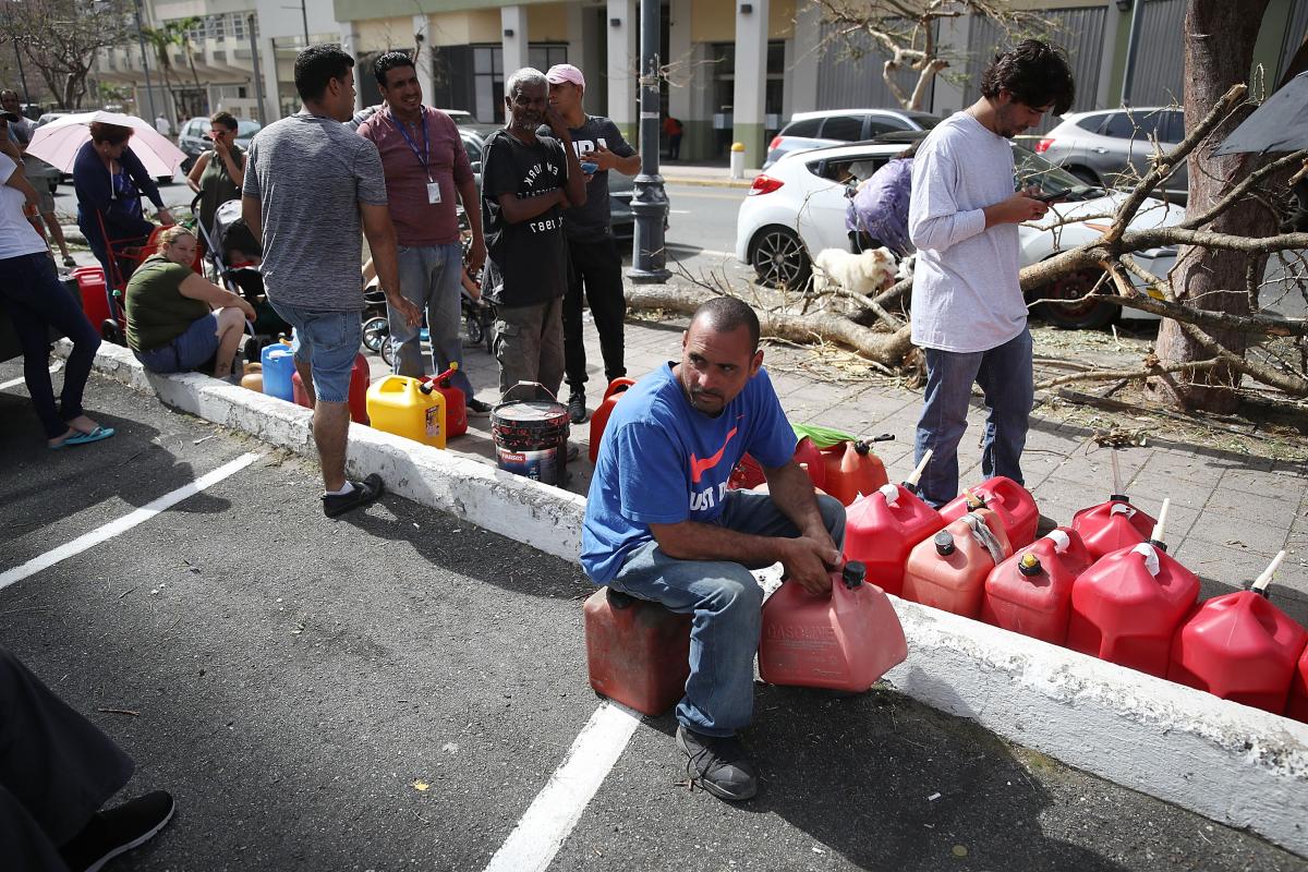 Man with gas cans in Puerto Rico