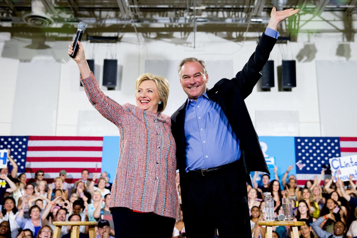 Tim Kaine and Hillary Clinton wave together