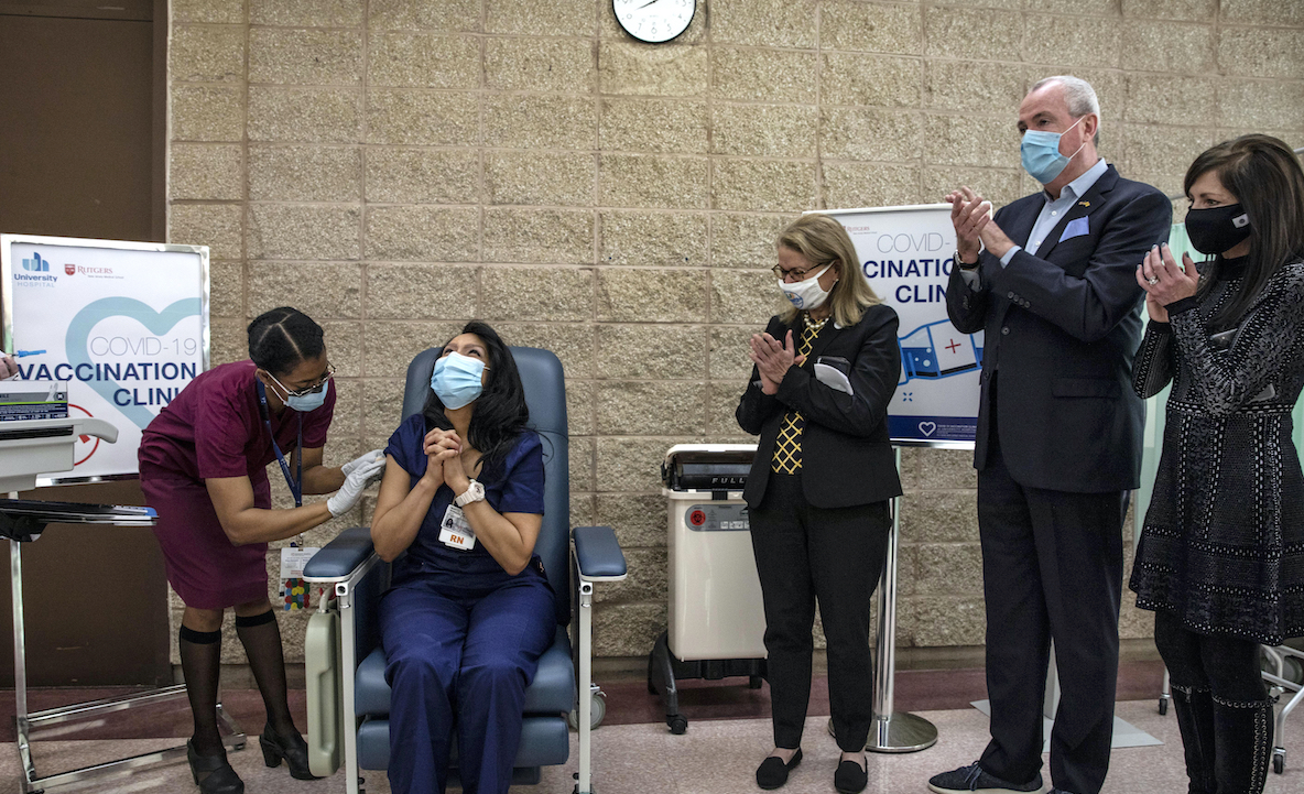 Happy NJ nurse gets covid vaccine 12/14