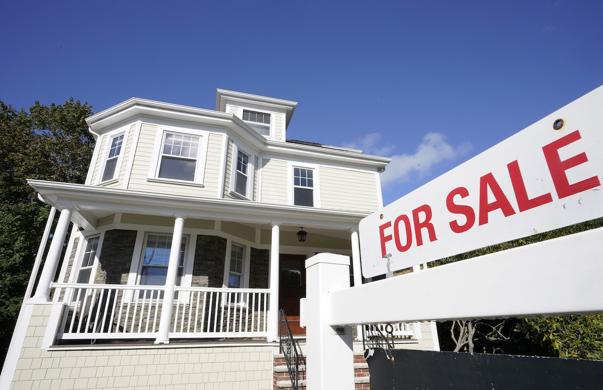 A for sale sign stands outside of a home in Westwood, Massachusetts, Oct. 6, 2020. (AP)