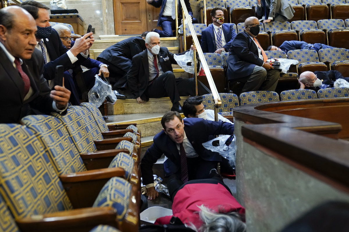 Members of Congress crouch down in House gallery Jan 6 2021