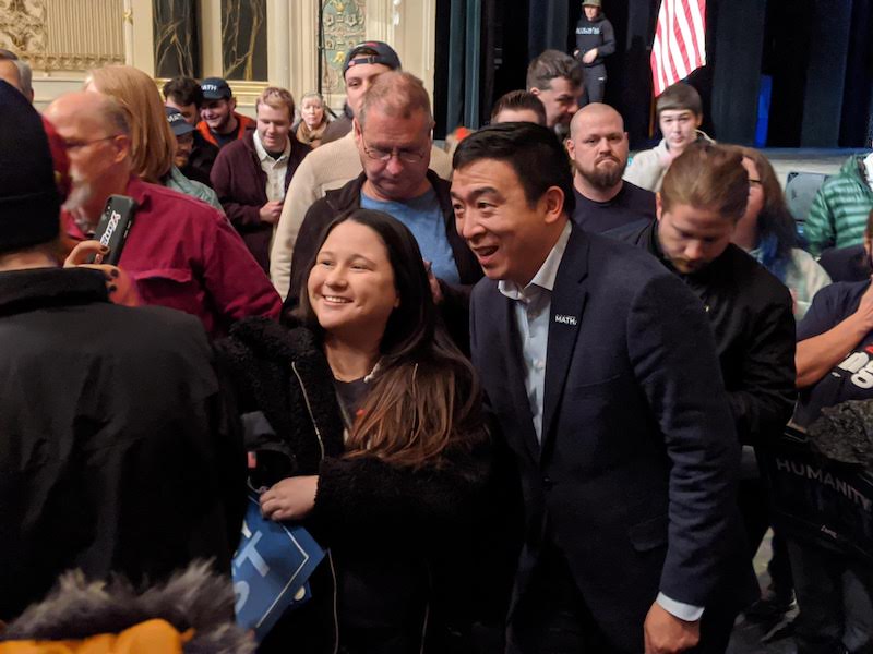 Andrew Yang with a fan in Keene, NH