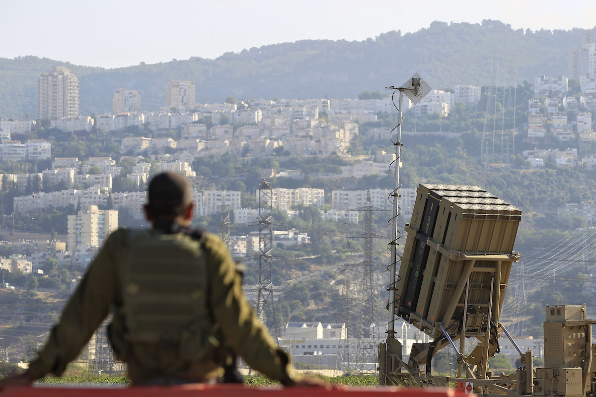 Israeli soldier next to Iron Dome rocket interceptor battery, Aug. 28, 2013