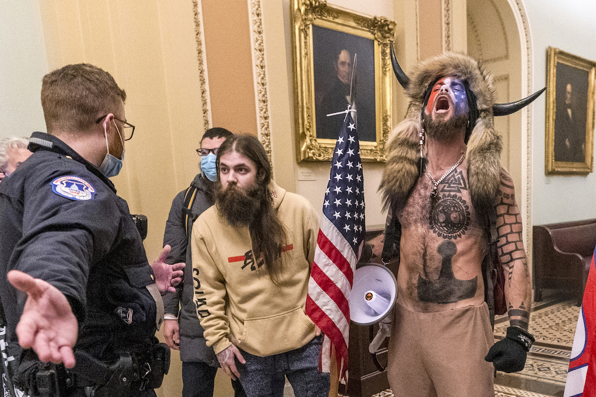 Jan. 6 rioters outside the Senate chamber encounter Capitol Police on Jan. 6, 2021
