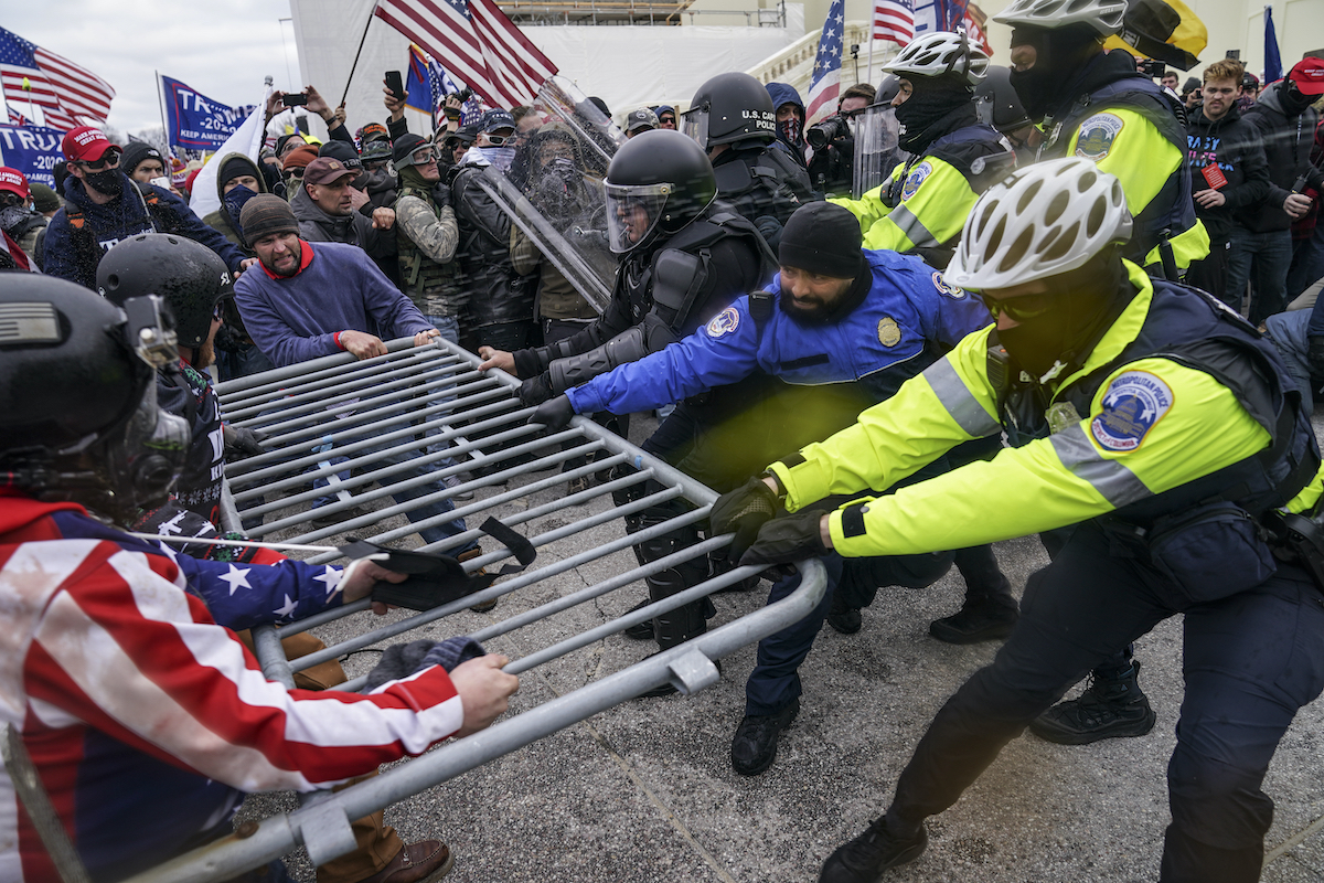 Barriers pulled down as crowd storms U.S. Capitol Jan 6, 2021