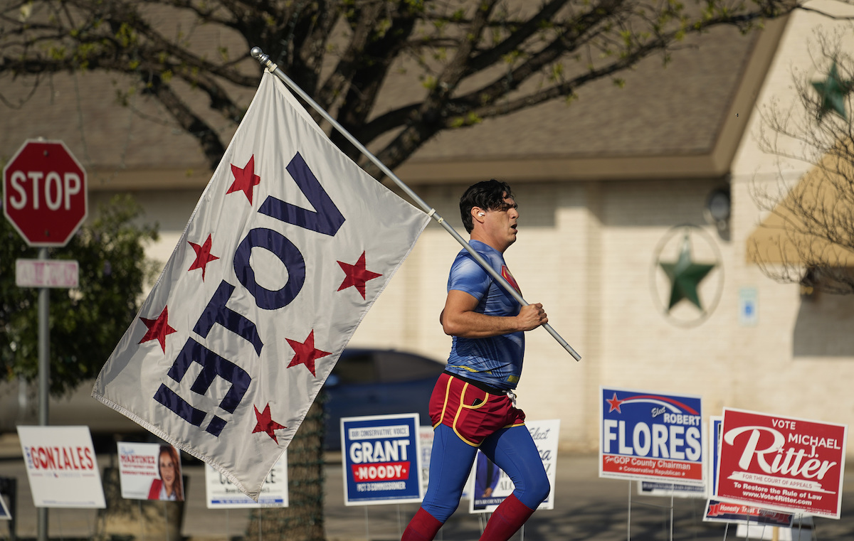 Jogger with "Vote!" flag March 5, 2024