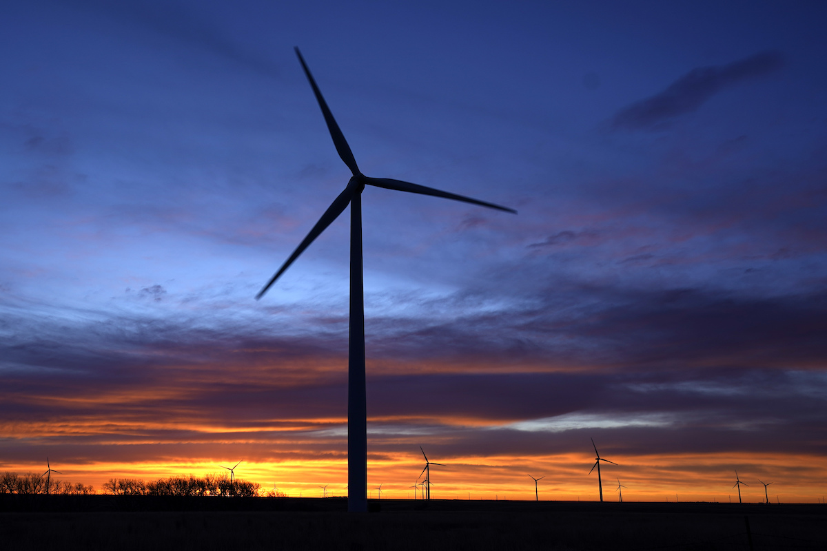 Kansas windmill silhouetted at dawn