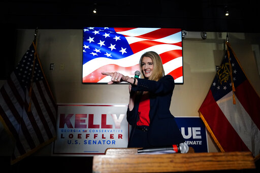 Kelly Loeffler Cumming, Ga Nov. 13, 2020 in front of a flag