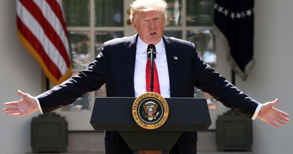 trump climate change wide hands photo